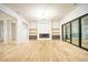 Bright living area with custom built-ins, fireplace, and large sliding glass doors at 4550 Jolyn Pl, Sandy Springs, GA 30342