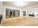 Spacious living room with hardwood floors and glass doors leading to the backyard at 4550 Jolyn Pl, Sandy Springs, GA 30342
