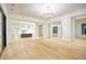 Open concept living area with hardwood floors and a modern kitchen at 4550 Jolyn Pl, Sandy Springs, GA 30342
