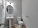 Bathroom featuring a pedestal sink, toilet, and neutral wall paint at 137 Staley Dr, Tucker, GA 30084