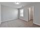 Bedroom featuring neutral paint, a window for natural light, and closet for storage at 137 Staley Dr, Tucker, GA 30084