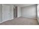 Bedroom featuring neutral walls, closet, and a window that provides natural light at 137 Staley Dr, Tucker, GA 30084