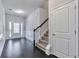 Inviting entry area featuring hardwood floors and a staircase at 137 Staley Dr, Tucker, GA 30084