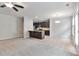 Bright and airy living space with a kitchen view and modern lighting at 137 Staley Dr, Tucker, GA 30084