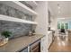 Wet bar features custom shelving and gray backsplash at 210 Marjean Way, Alpharetta, GA 30009