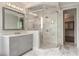 Stylish bathroom with glass enclosed shower, double sink vanity, and elegant lighting at 210 Marjean Way, Alpharetta, GA 30009
