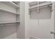 Walk-in closet with custom shelving and chrome rods at 210 Marjean Way, Alpharetta, GA 30009