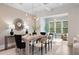 Bright dining room with elegant lighting fixture and stylish decor, creating an inviting atmosphere at 210 Marjean Way, Alpharetta, GA 30009