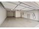 Spacious garage with epoxy flooring, white walls, and door to the interior of the home at 210 Marjean Way, Alpharetta, GA 30009
