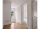 Bright hallway with hardwood floors and natural light, highlighting the home's clean architectural lines at 210 Marjean Way, Alpharetta, GA 30009