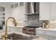 Beautiful kitchen featuring a stainless steel stove with red knobs and marble countertops at 210 Marjean Way, Alpharetta, GA 30009