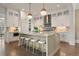 Modern kitchen featuring a large island, stainless steel appliances, and pendant lighting at 210 Marjean Way, Alpharetta, GA 30009