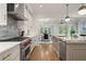 Gourmet kitchen with stainless steel appliances, marble countertops and center kitchen island at 210 Marjean Way, Alpharetta, GA 30009