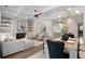 Cozy living room with fireplace, built-in shelves, and open layout connecting to the dining and kitchen areas at 210 Marjean Way, Alpharetta, GA 30009