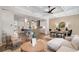 Spacious living room featuring an open floor plan with modern kitchen, dining area, and hardwood floors at 210 Marjean Way, Alpharetta, GA 30009
