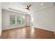 Serene main bedroom with tray ceiling, hardwood floors, and en-suite bathroom for ultimate relaxation at 210 Marjean Way, Alpharetta, GA 30009