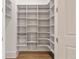 Custom pantry with open shelving and basket storage at 210 Marjean Way, Alpharetta, GA 30009