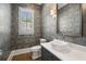 Chic powder room featuring designer wallpaper, modern vanity, and wood flooring at 210 Marjean Way, Alpharetta, GA 30009