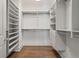 Organized walk-in closet with custom shelving, drawers, and wood floors at 210 Marjean Way, Alpharetta, GA 30009