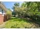 Lush backyard with mature trees, offering privacy and a serene outdoor space at 2785 Toney Dr, Decatur, GA 30032