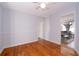 Bedroom featuring wood floors, natural light, and a view into the living room at 2785 Toney Dr, Decatur, GA 30032