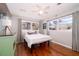 Bright bedroom with hardwood floors, ceiling fan, and two windows providing natural light at 2785 Toney Dr, Decatur, GA 30032