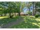 Traditional home with a large front lawn and mature trees at 2785 Toney Dr, Decatur, GA 30032