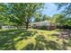 Well maintained home featuring a large front yard with mature trees and a classic brick facade at 2785 Toney Dr, Decatur, GA 30032