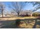 Spacious front yard with mature trees and a well-maintained lawn at 2785 Toney Dr, Decatur, GA 30032