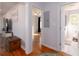 Hallway view with wood floors, connecting living area, bathroom, and bedrooms at 2785 Toney Dr, Decatur, GA 30032