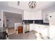 Updated kitchen boasts white cabinets, stainless appliances, and stylish backsplash for a modern touch at 2785 Toney Dr, Decatur, GA 30032