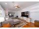 Spacious living room with hardwood floors, ceiling fan and large windows at 2785 Toney Dr, Decatur, GA 30032