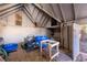 Interior of the shed with exposed rafters and various storage items at 2785 Toney Dr, Decatur, GA 30032