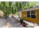 Beautiful stone and gravel landscaping features a walkway and mature trees surrounding the yard at 435 Mcwilliams Se Ave, Atlanta, GA 30316