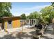 Landscaped backyard with a shed, patio area, gravel, and mature trees offering a serene outdoor space at 435 Mcwilliams Se Ave, Atlanta, GA 30316