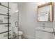 Modern bathroom featuring a glass-enclosed shower, floating vanity, and neutral tile at 435 Mcwilliams Se Ave, Atlanta, GA 30316