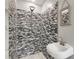 Modern bathroom featuring pedestal sink and shower with patterned tile at 435 Mcwilliams Se Ave, Atlanta, GA 30316