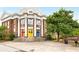 Exterior view of Eastside Church featuring colorful doors and classic architectural details with brick and white columns at 435 Mcwilliams Se Ave, Atlanta, GA 30316