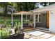 Inviting front porch with ample seating, string lights, and lush landscaping, perfect for relaxing at 435 Mcwilliams Se Ave, Atlanta, GA 30316