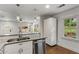 Bright kitchen featuring stainless steel appliances, quartz countertops, and a large sink at 435 Mcwilliams Se Ave, Atlanta, GA 30316