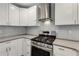 Close up on kitchen with stainless steel appliances, modern countertops and sleek gas range at 435 Mcwilliams Se Ave, Atlanta, GA 30316