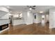 Bright open living space featuring hardwood flooring, fireplace, and seamless kitchen access at 435 Mcwilliams Se Ave, Atlanta, GA 30316
