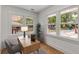 Sunlit office space featuring hardwood floors, a modern desk, and multiple windows at 435 Mcwilliams Se Ave, Atlanta, GA 30316