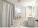 Basement bathroom includes a sink, toilet and shower with curtain at 503 Hearthstone Rdg, Woodstock, GA 30189