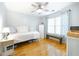 Bedroom featuring hardwood floors, large window and a bench at 503 Hearthstone Rdg, Woodstock, GA 30189