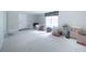 Bonus room with carpet and a window is full of boxes and storage items at 503 Hearthstone Rdg, Woodstock, GA 30189
