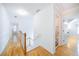 Bright hallway with hardwood floors leads to several rooms at 503 Hearthstone Rdg, Woodstock, GA 30189