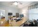 Bright home office features natural light, desk space, and modern ceiling fan at 503 Hearthstone Rdg, Woodstock, GA 30189