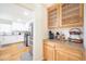 Butler's pantry featuring wooden countertops, storage cabinets, and doorway into the kitchen at 503 Hearthstone Rdg, Woodstock, GA 30189