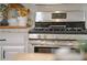 Stainless steel stove in modern kitchen with granite countertops and white cabinets at 503 Hearthstone Rdg, Woodstock, GA 30189